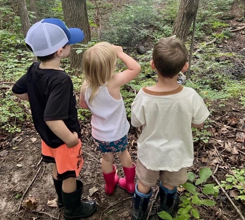 Kid's walking in grass